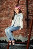 57836314-modern-8-year-old-girl-wearing-jeans-clothes-posing-on-the-city-street-by-a-brick-wal...jpg