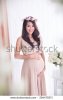 beautiful-asian-pregnant-woman-posing-with-flower-crown-on-her-head.jpg