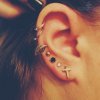 feather-and-cross-studs-ear-piercings.jpg